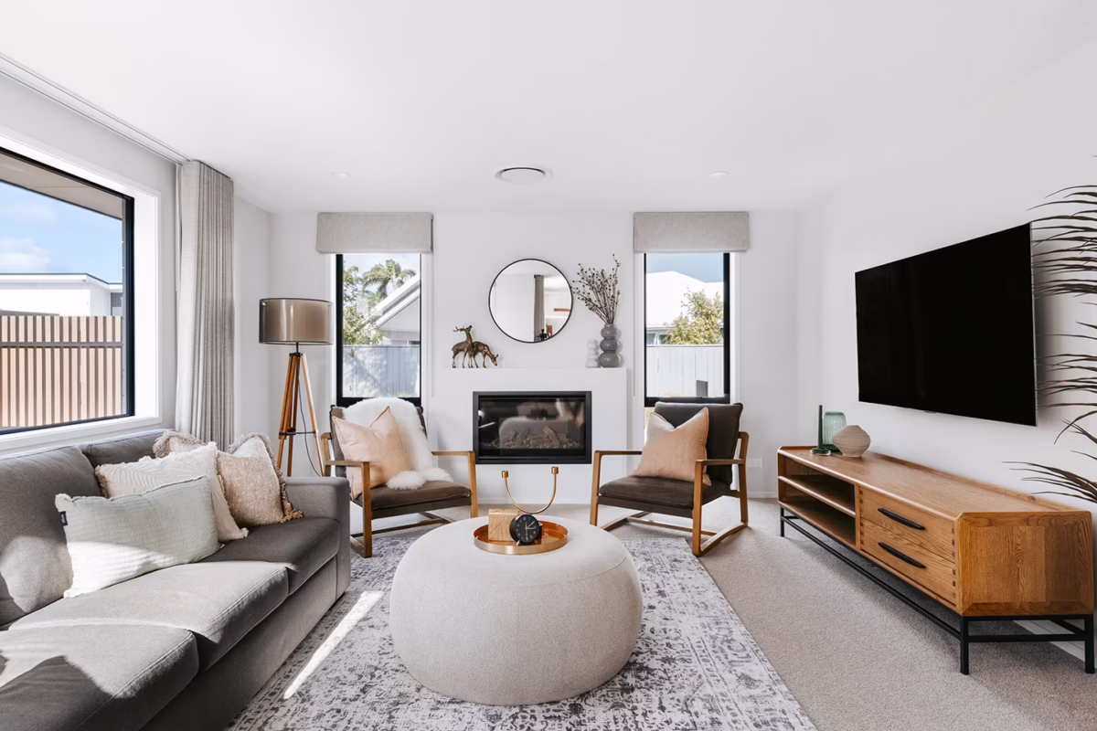 living room with entertainment area in a new home build by first homes tauranga
